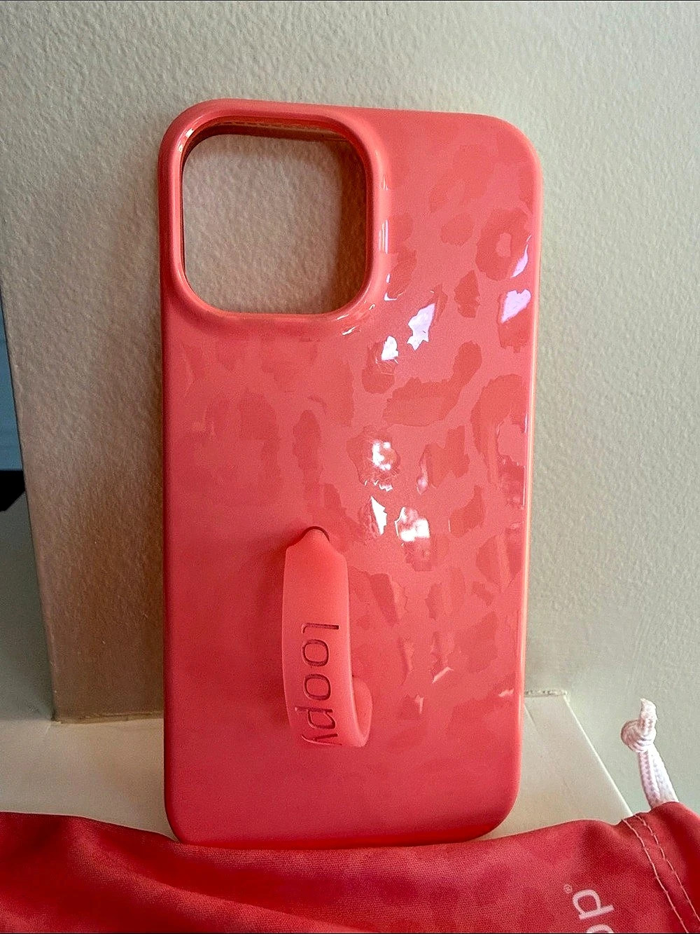 Loopy Pink Phone Case with Hand Strap. Size 6.7”P. Comes with bag. iPhone case